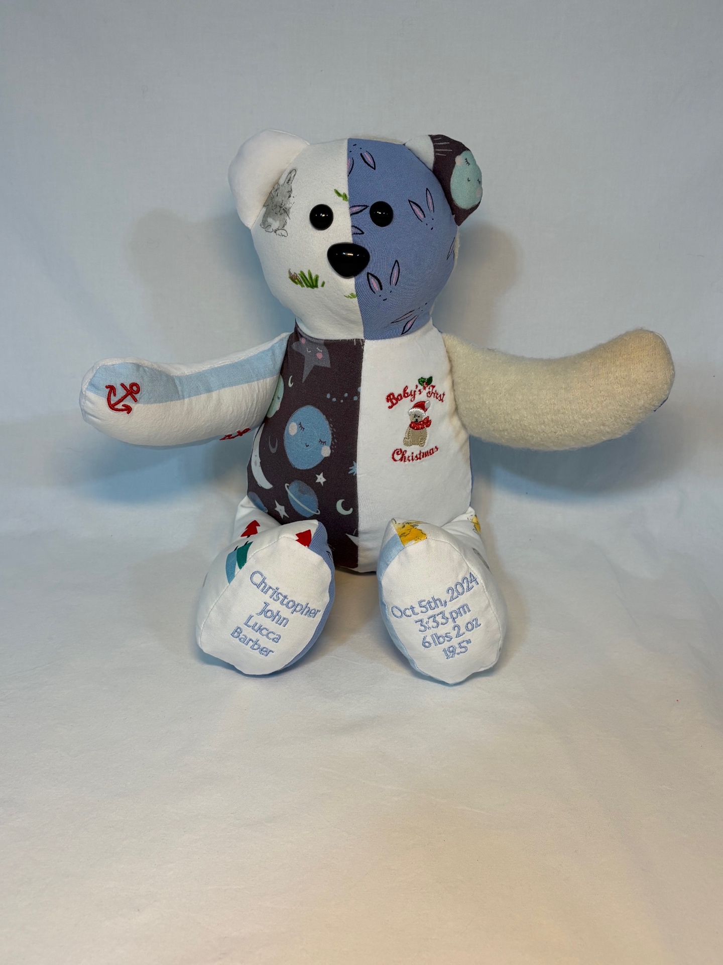 Baby memory bear from Christopher's first outfits with birth stats embroidered on the feet
