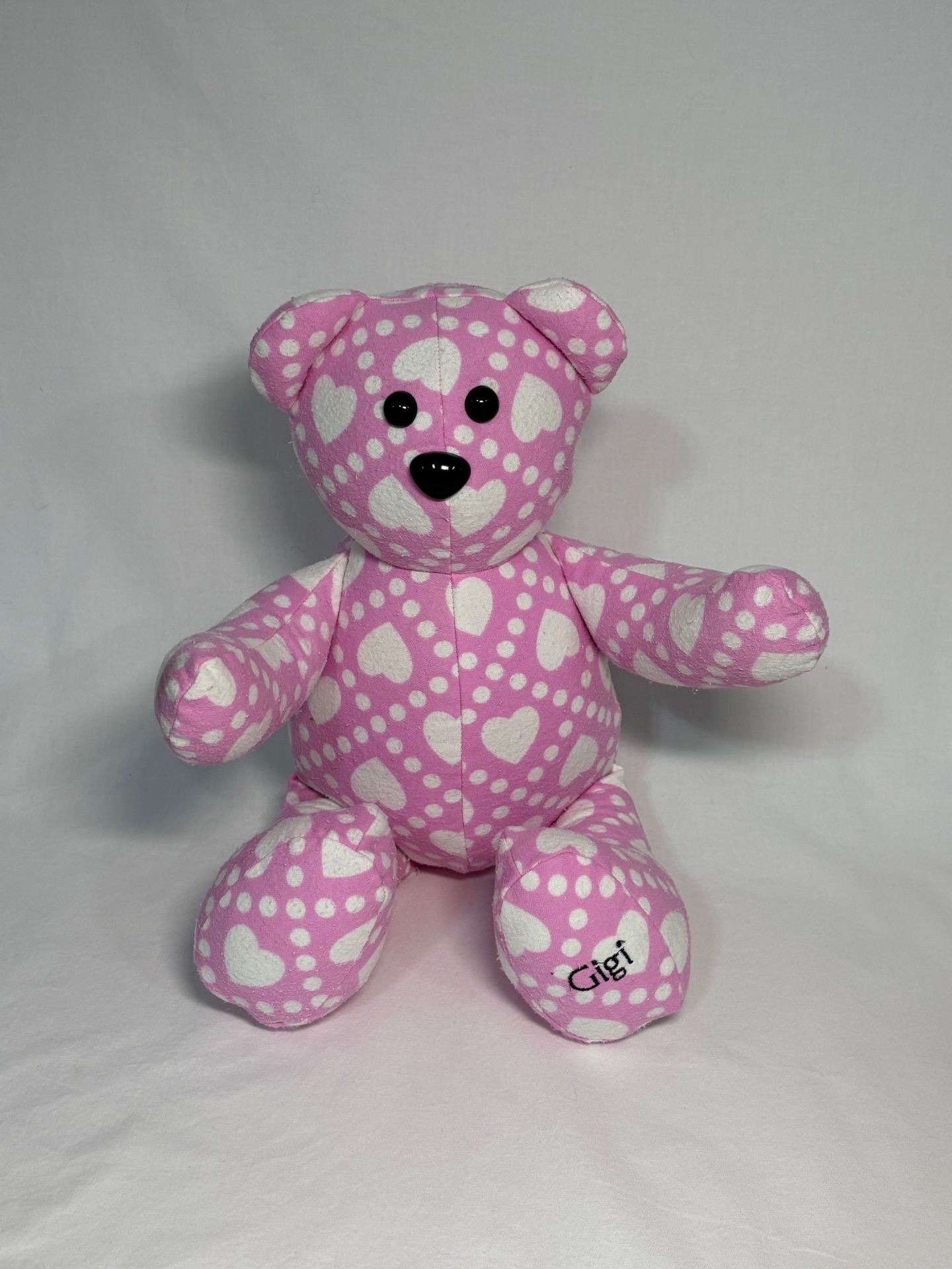 Pink polka dot and heart memory bear with 'Gigi' embroidered on the foot