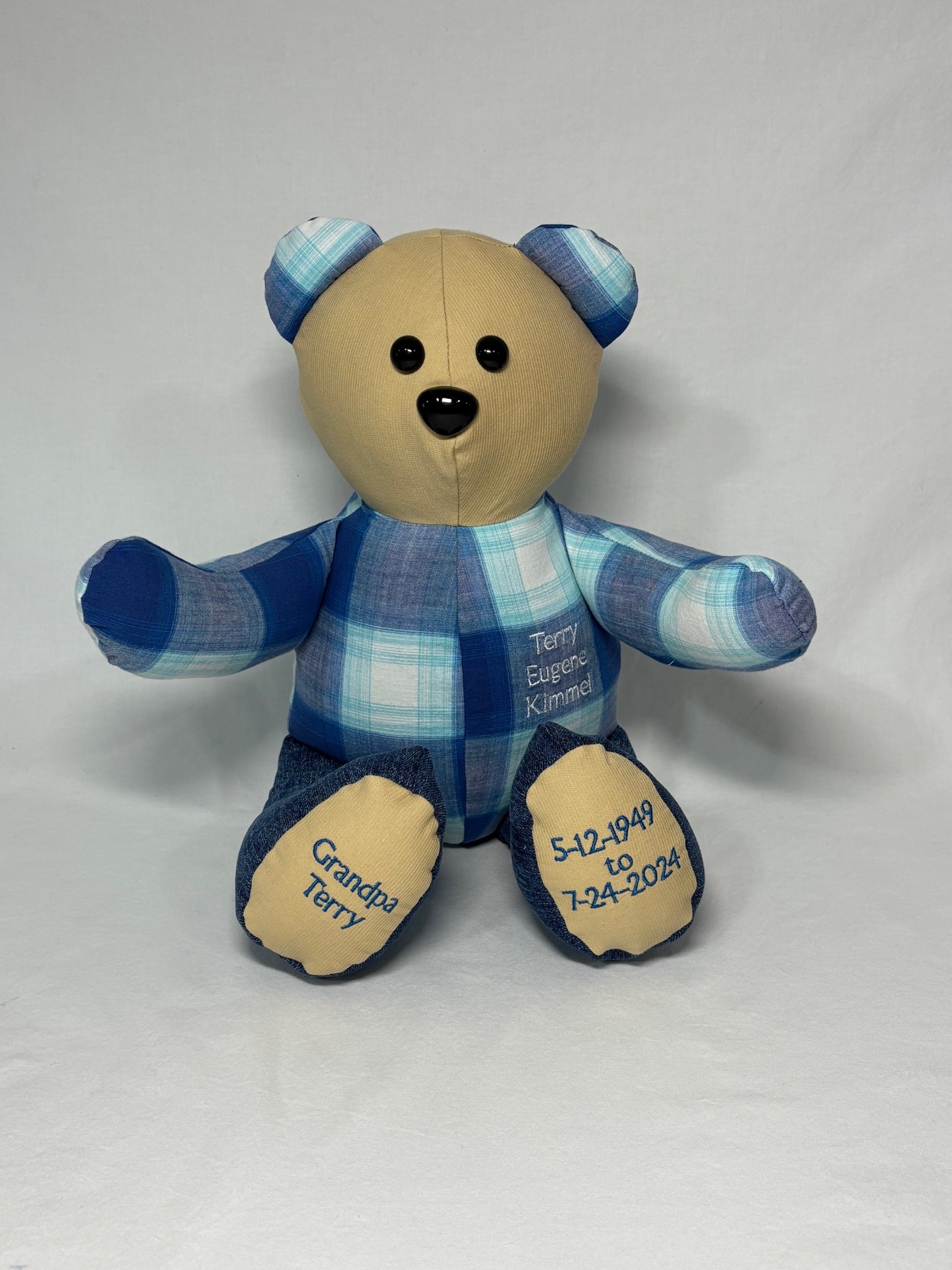 Grandpa Terry memory bear made from a blue plaid shirt with embroidered name and dates